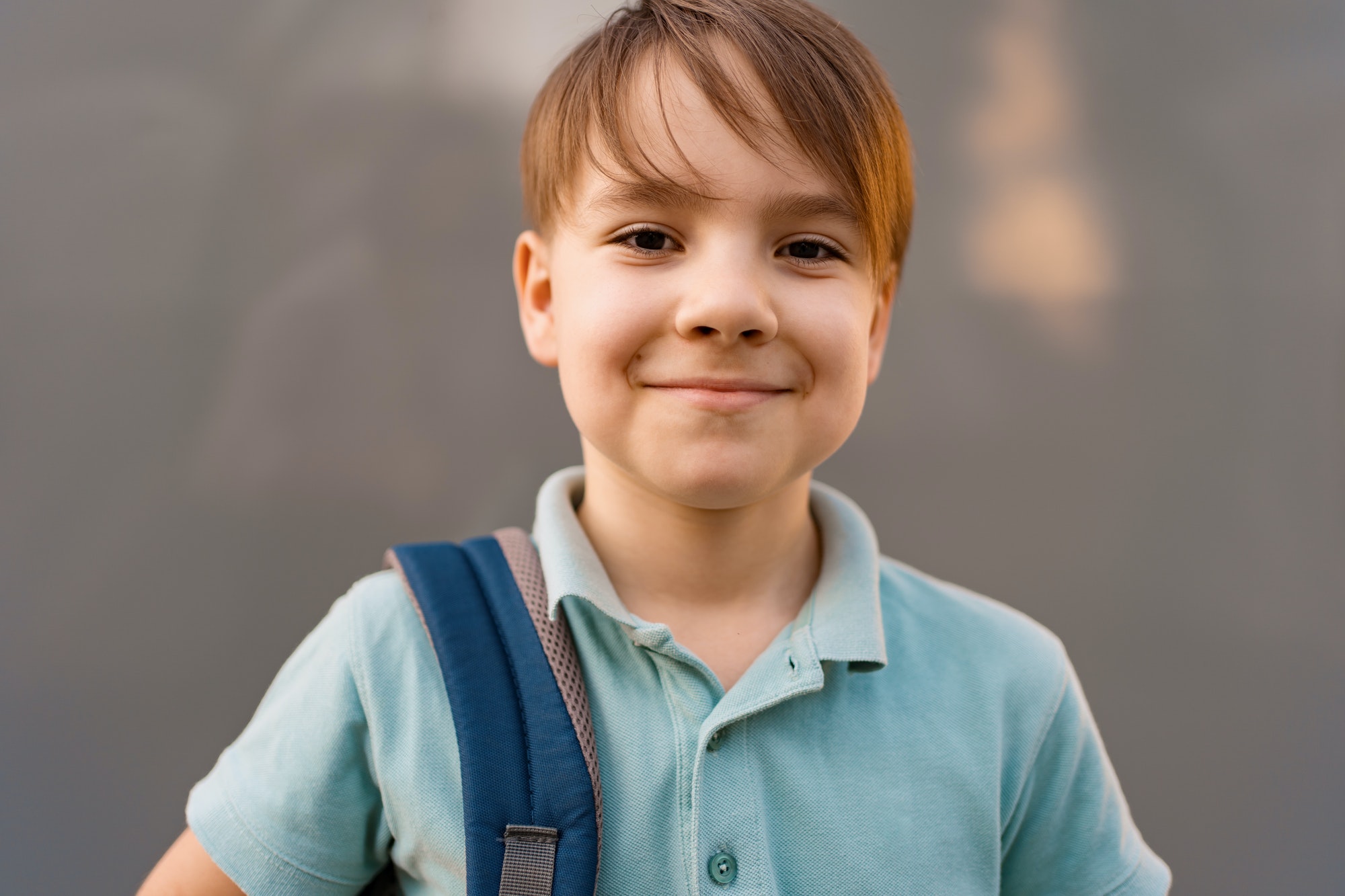 School-age child wearing a backpack; illustrative image.