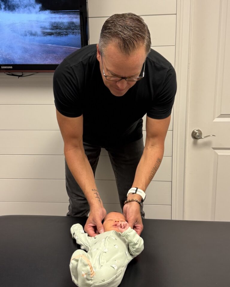 Dr. Salminen checking Sophie during a visit at Alpha Spine Center